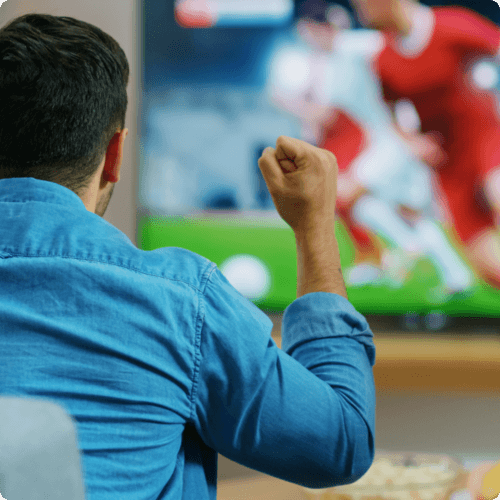 Man Watching Football on TV